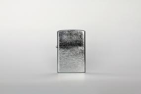 silver gas lighter on white