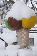 ice cream cone sculpture in the snow