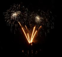 golden fireworks in black sky