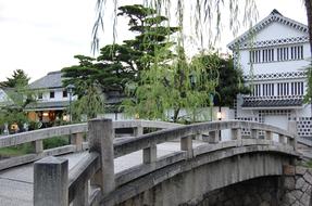 Beautiful bridge, green plants and buildings in Kurashimi, Okayama, Japan