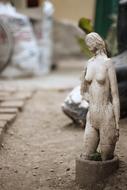 woman statue among old ruins