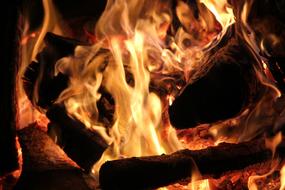 Close-up of the colorful, burning open fire, with the wood