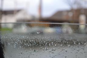 wet glass in the rain on a blurred background