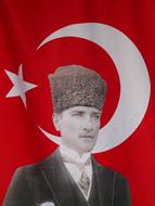 portrait of mustafa kemal against the background of the turkish flag