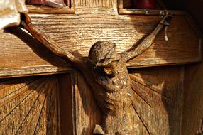 wooden sculpture of crucified Jesus in the cemetery