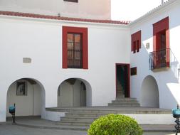 Beautiful and colorful house, with the plants, in Casar De CÃ¡ceres, Spain, in light and shadow