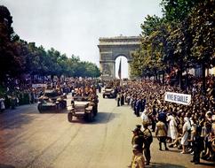photo of the military parade through the Arc de Triomphe in Paris