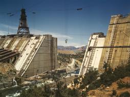 Colorful and beautiful landscape with the Shasta Dam and mountains in California, USA, at blue sky on background