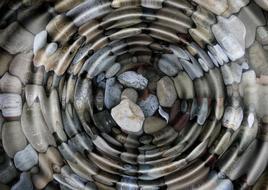 stones pebble in water waves