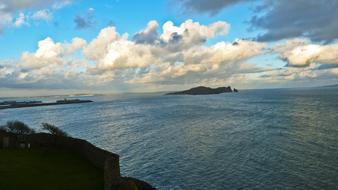 Beautiful seascape in Ireland, under the blue sky with clouds