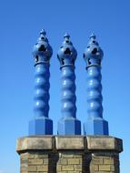 Shiny, blue chimney on the Zsolnay in Hungary, under the blue sky