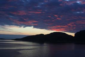 view from the water of Hurtigruten at dusk, Scandinavia