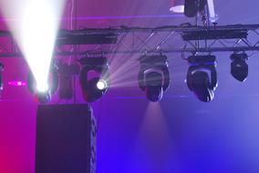 spotlights on stage during a concert