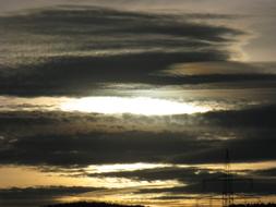 gray clouds in the yellow evening sky