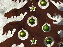 Close-up of the beautiful fir tree decoration, with shiny decorations, in light