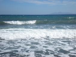 Beautiful beach of Santorini, Greece, with waves