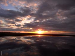 sunrise on the horizon of the lake