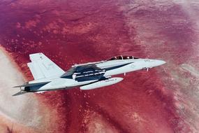 plane flies over china lake