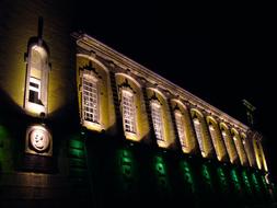 building with illuminated windows in the evening