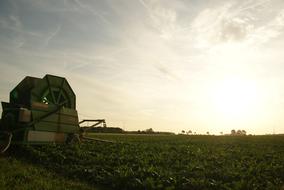 machine mechanism in the field at dusk