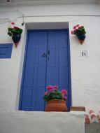 blue door and white building in Andalusia, Spain