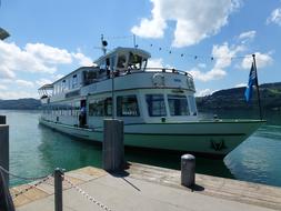 yacht near a wooden bridge on the sea