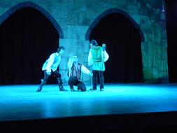 actors on stage during performance