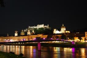 Beautiful landscape of the Hohensalzburg on the coast of Salzburg, Austria, with colorful lights, at the night