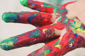 colorful paint on the child's hand