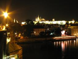 Beautiful coast of Prague, Czech Republic, with the castle, buildings and lights, at the night