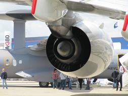 Close-up of the engine of the "Airbus A380", around the people at the airport in Paris, France