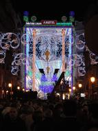 People at the part with colorful stage with lights, in Valencia, Spain, at the night