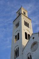 tower on the cathedral against the backdrop of a cloudy sky