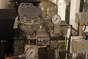 Technical installation with signs, in the machine room of the boat