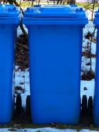 blue Wheelie bins outdoor at snowy winter