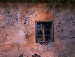 old broken window on the priest's house