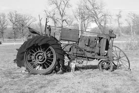 Tractor Antique Vintage on the field in monochrome