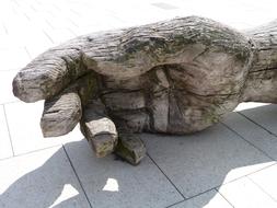 wooden sculpture of a human hand