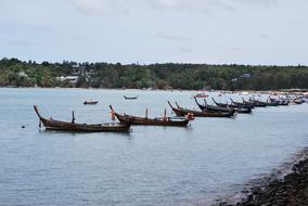 wooden fishing boats along the river