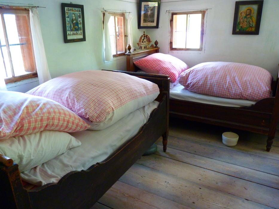 Colorful beds, with the pillows, in the Farmhouse, with the windows, with light