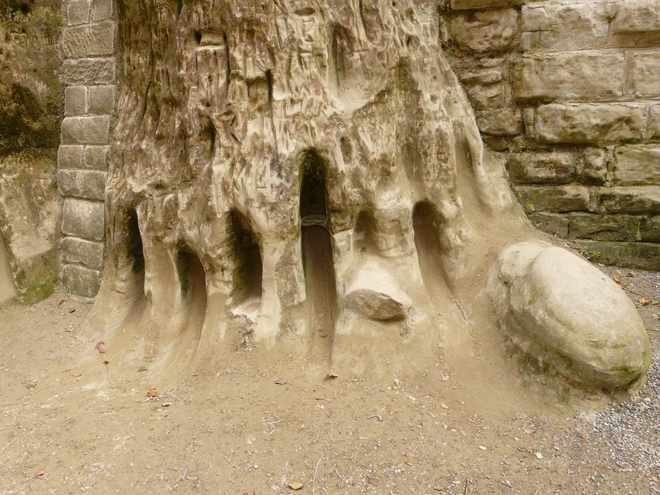 Close-up of the stones walls, among the sand