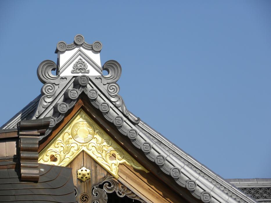 top of ornate carved wooden Roof at Sky