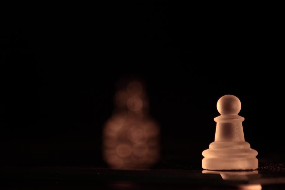 Chess Pawn white back background