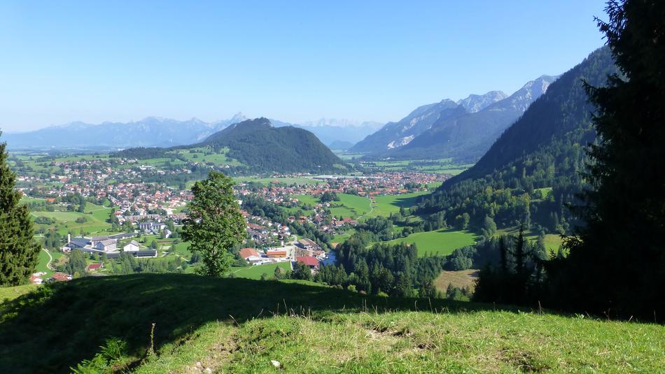 Beautiful view of the buildings and green mountains in Allgäu, Germany