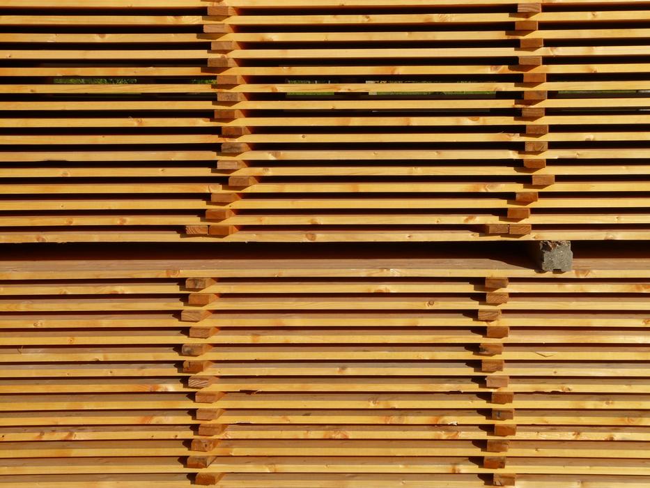 a pile of sawn boards at a sawmill