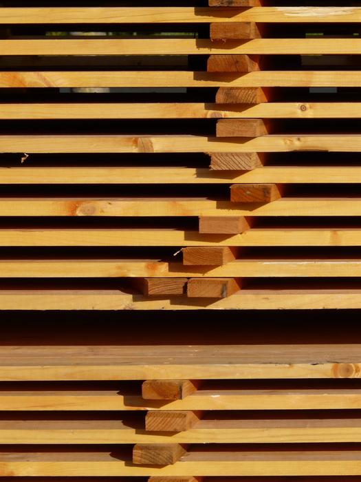 Stack of the brown and yellow plank board