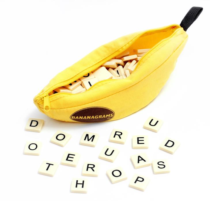 Bananagrams scrabble toys with the pieces with signs, on the white surface