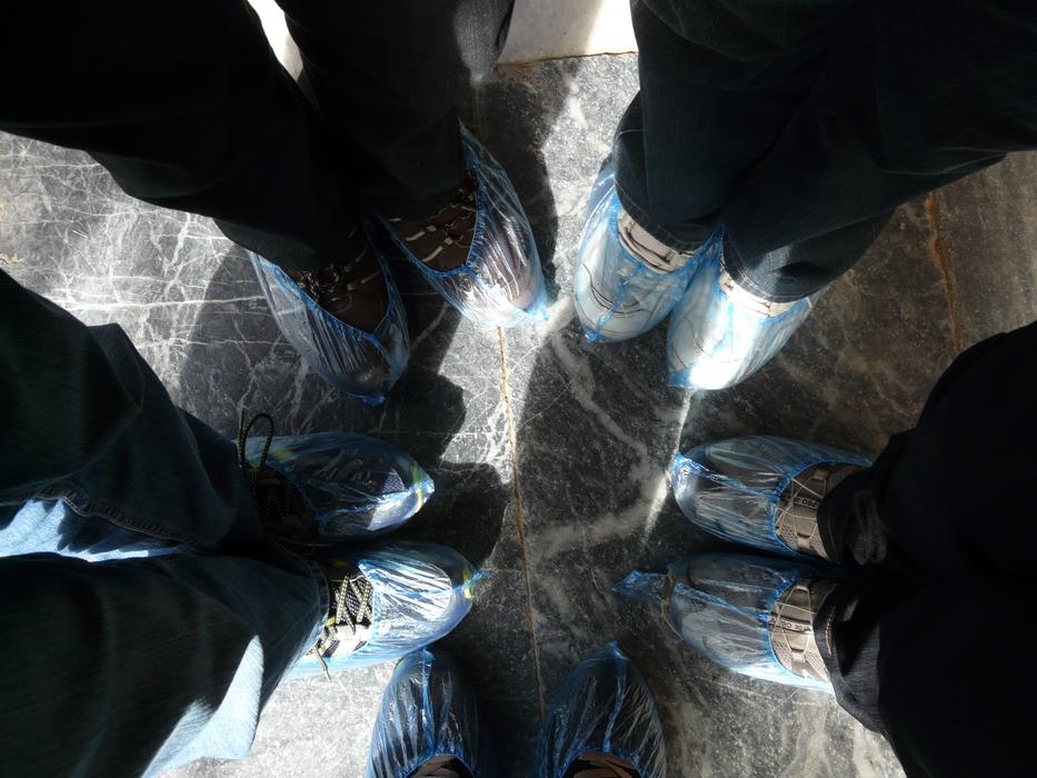 Top view of the shoes of the people, in shoe covers