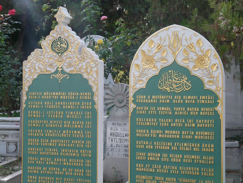 gravestones with inscriptions in a cemetery in turkey