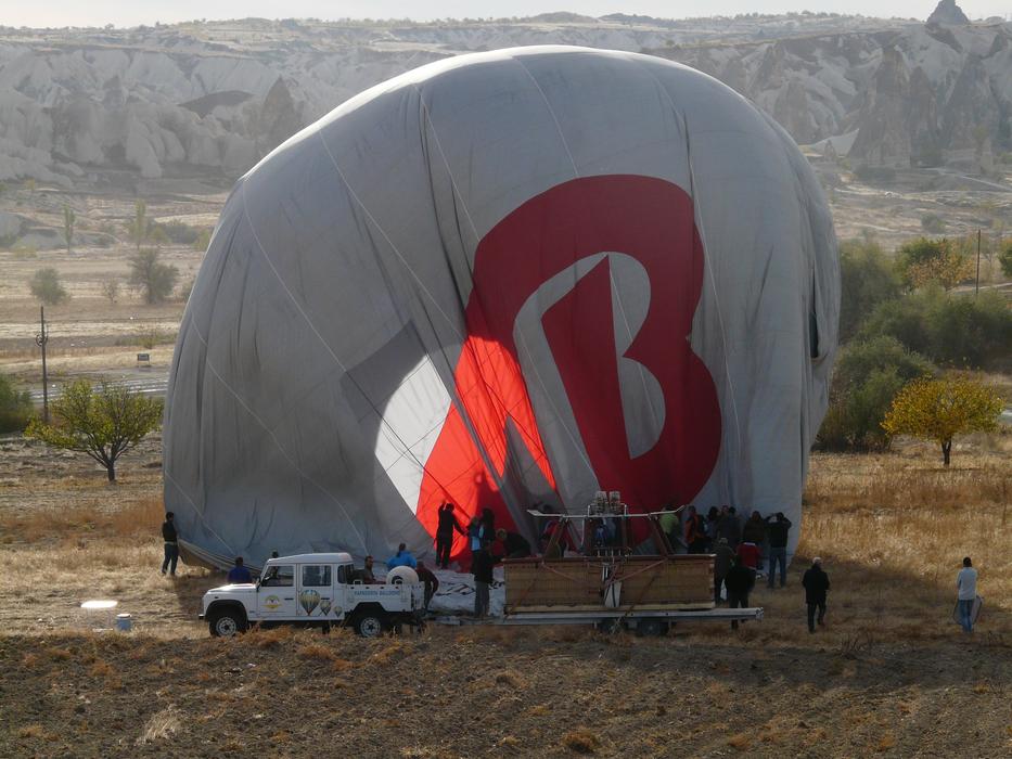 fold the hot air balloon into the car trailer